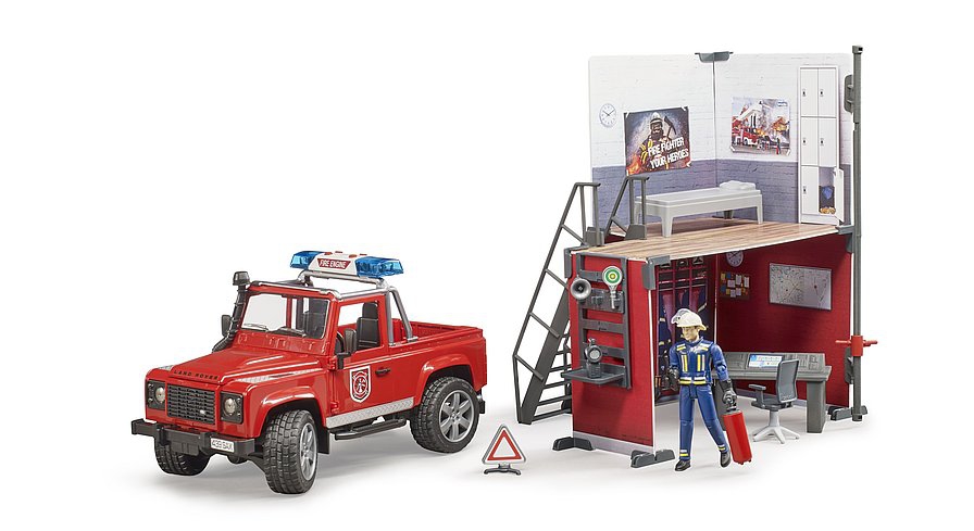 BRUDER FIRE STATION WITH LAND ROVER AND FIREMAN